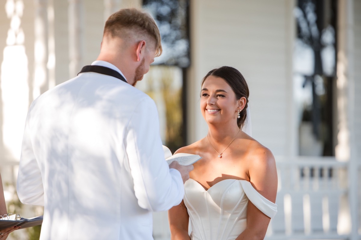 Just married couple exiting ceremony at Barr Mansion captured by The Bird and The Bear