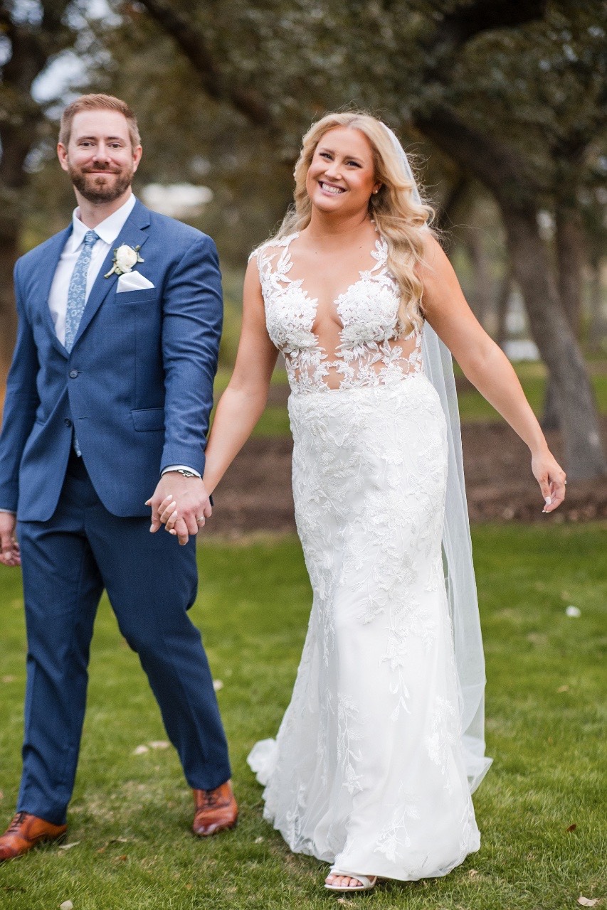 Newlyweds exiting ceremony at Canyonwood Ridge winter outdoor wedding venue