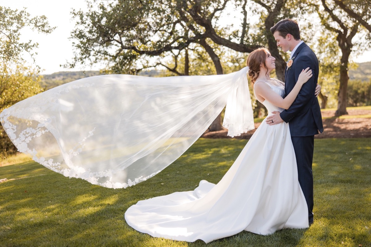 Couple's candid moment during portrait session at Canyonwood Ridge Texas venue