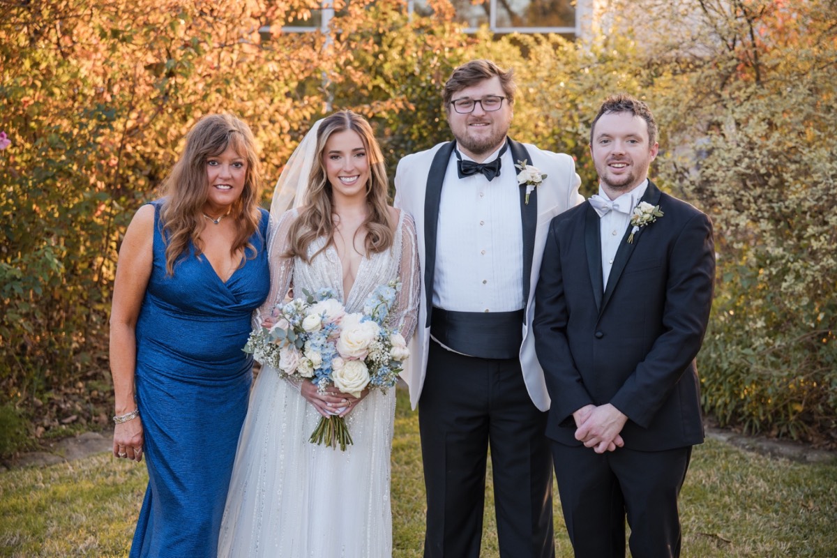 S and A walking together as newlyweds at Barr Mansion winter wedding.