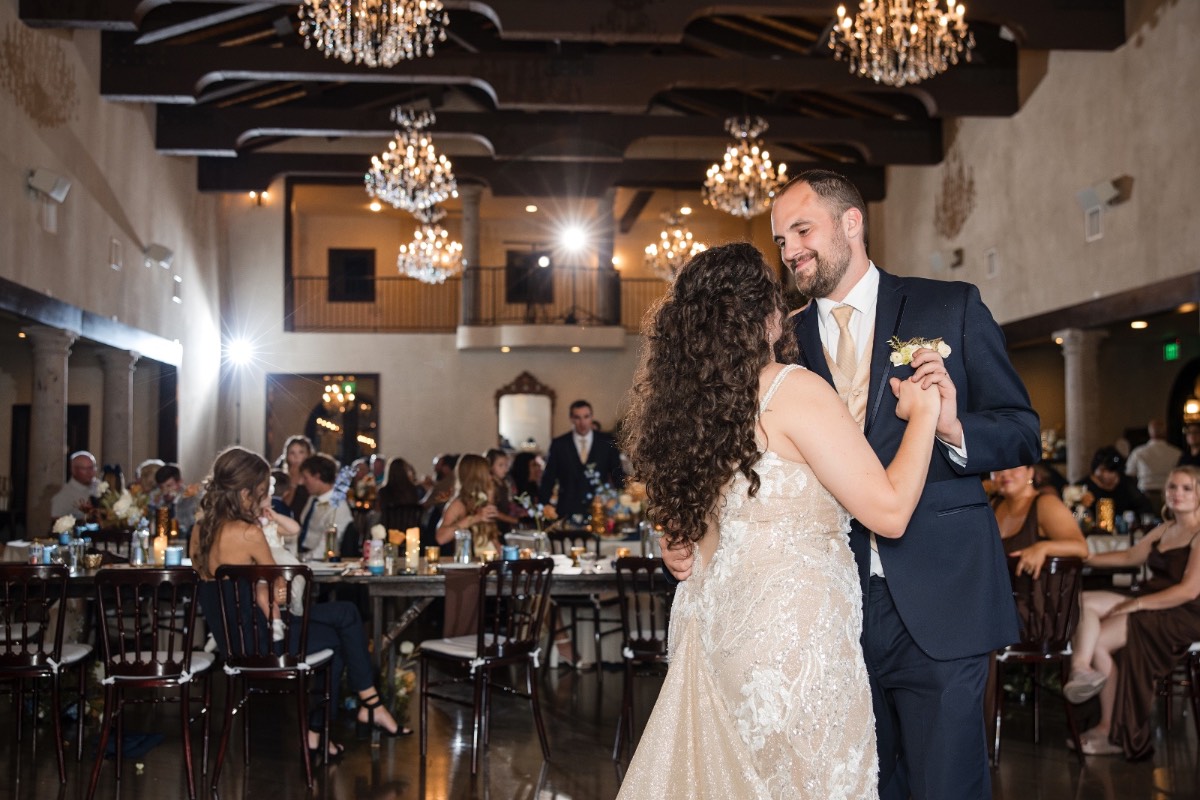 Newlyweds laughing together during candid photography session at Dripping Springs location