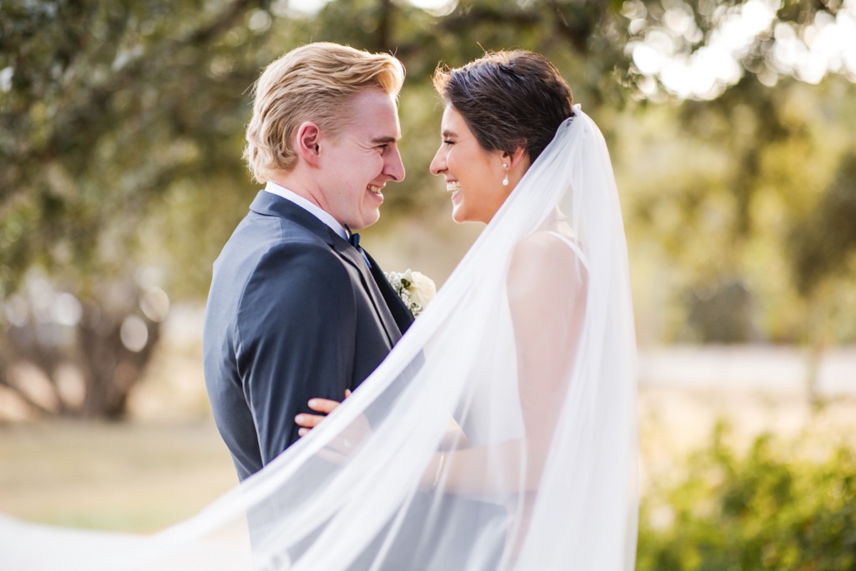 K and N posing for their Retreat at Balcones Springs wedding photographer