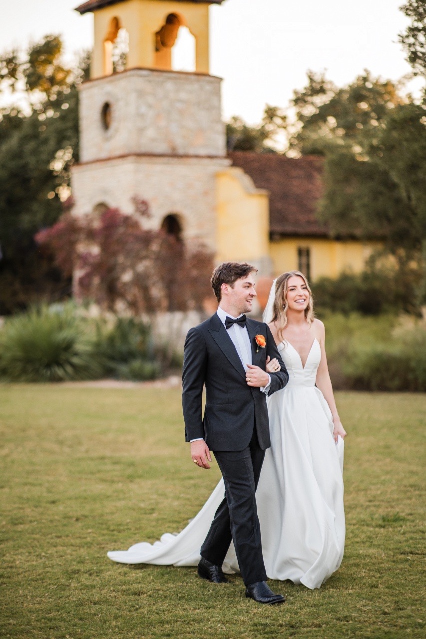 Newlyweds first dance with romantic lighting at Ian's Chapel Camp Lucy wedding
