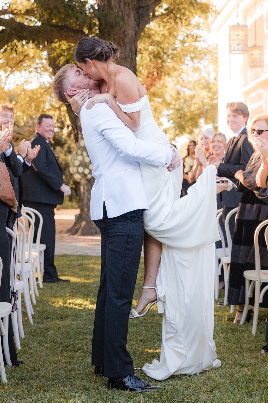 Guests celebrating as M and S leave ceremony at Barr Mansion wedding
