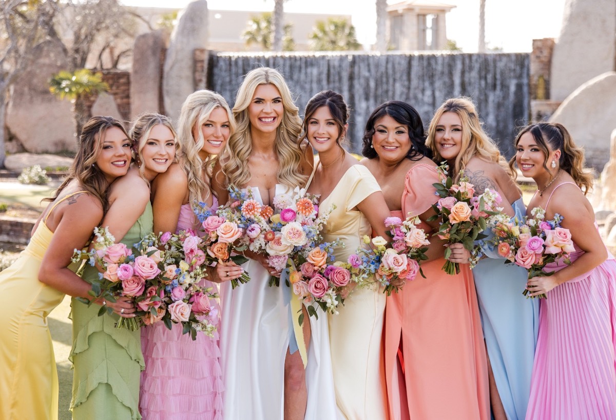 Bridal party helps bride A with dress at Horseshoe Bay Resort venue