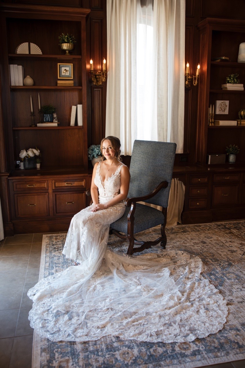 Bride applying makeup during getting ready session at Georgetown venue