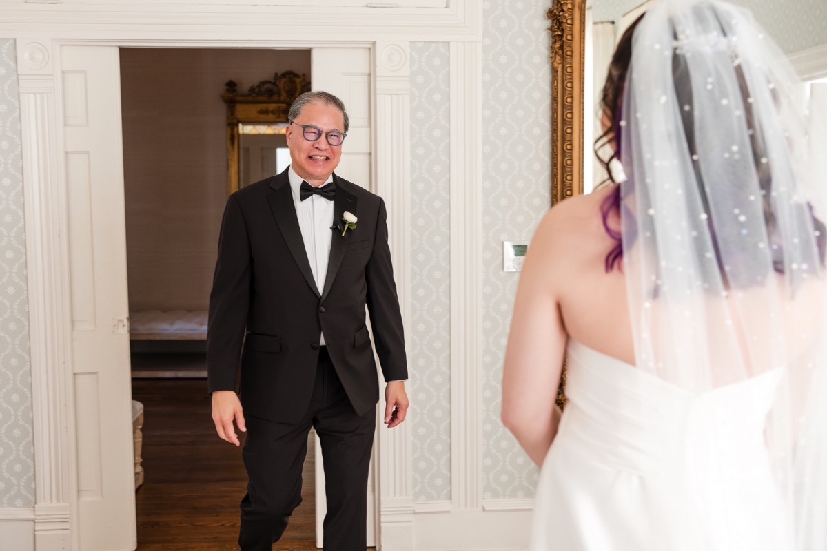 Bridesmaids helping bride with veil at Round Rock Texas wedding venue