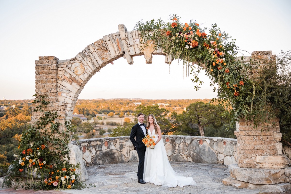 Wedding reception dancing under bistro lights at Camp Lucy Dripping Springs