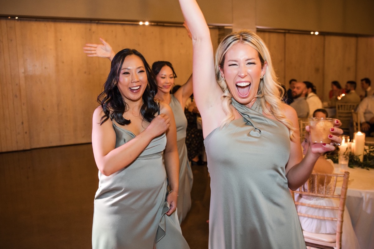 Cheering guests witnessing K and M's recessional at Canyonwood Ridge
