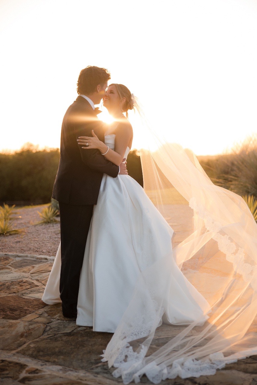Bride and groom greeting guests during reception at Lampasas venue