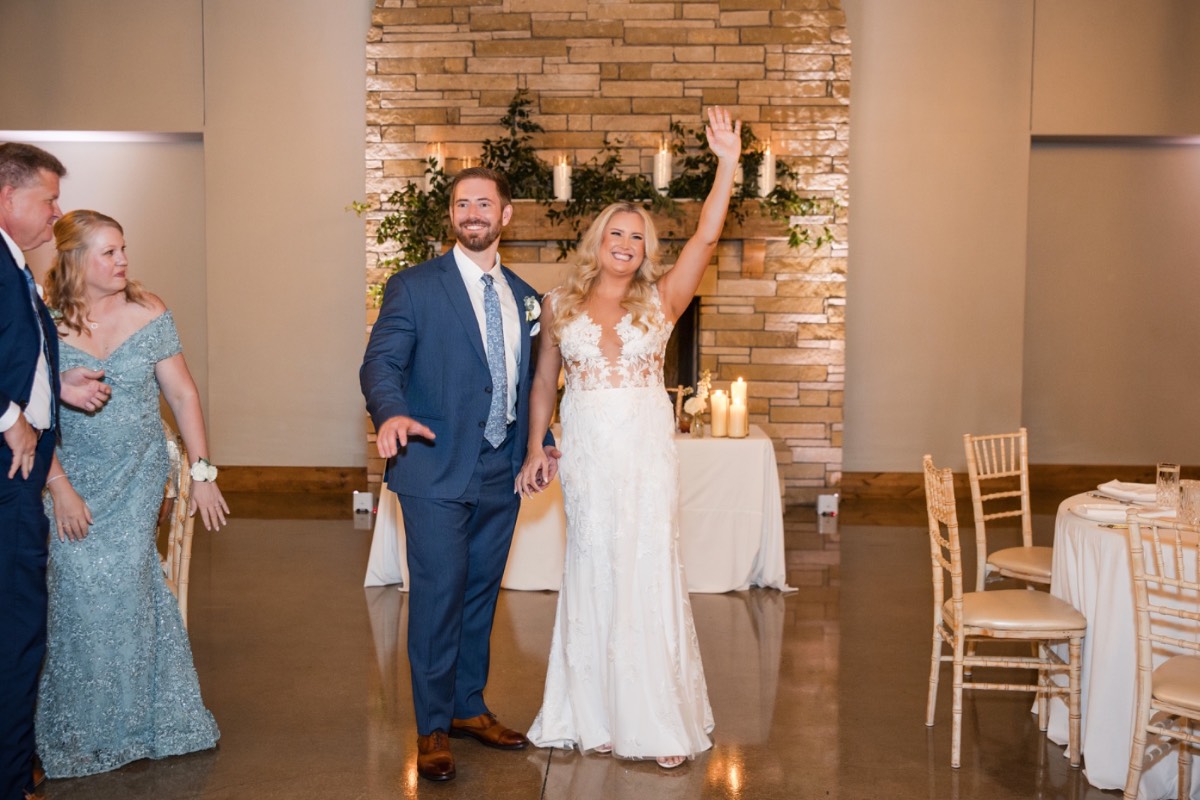 Videographer capturing recessional at Canyonwood Ridge winter wedding by The Bird and The Bear