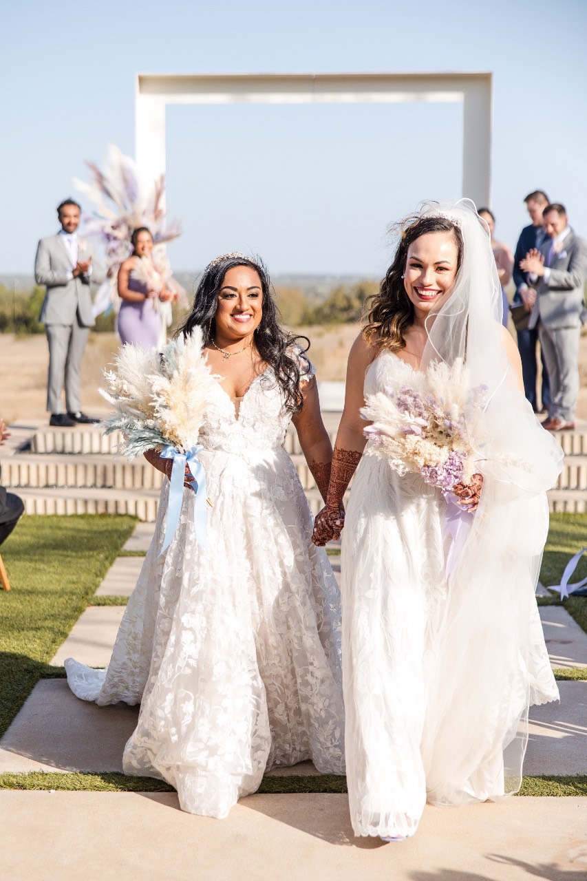 two brides celebrate after their lgbtq wedding in Austin tx at prospect house
