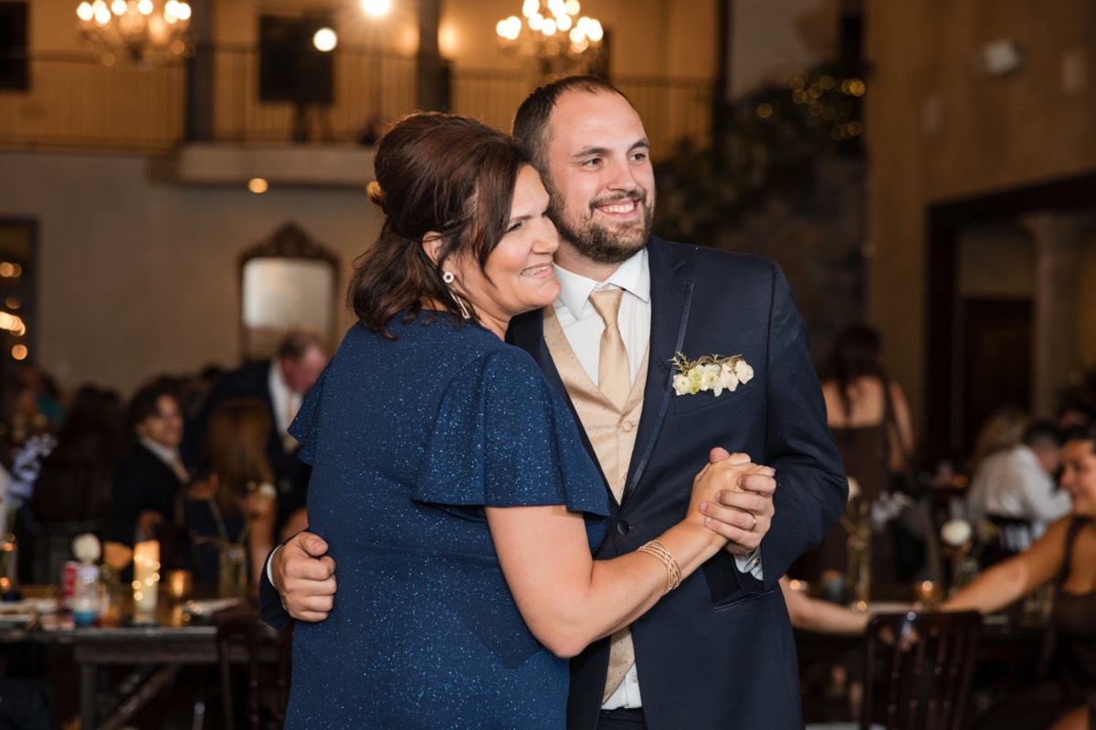 Groom's loving gaze at bride during intimate Ma Maison portrait session