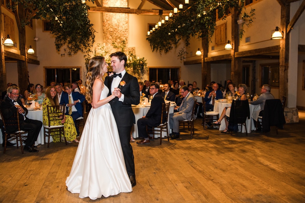 Bride dancing with guests at lively Camp Lucy wedding reception