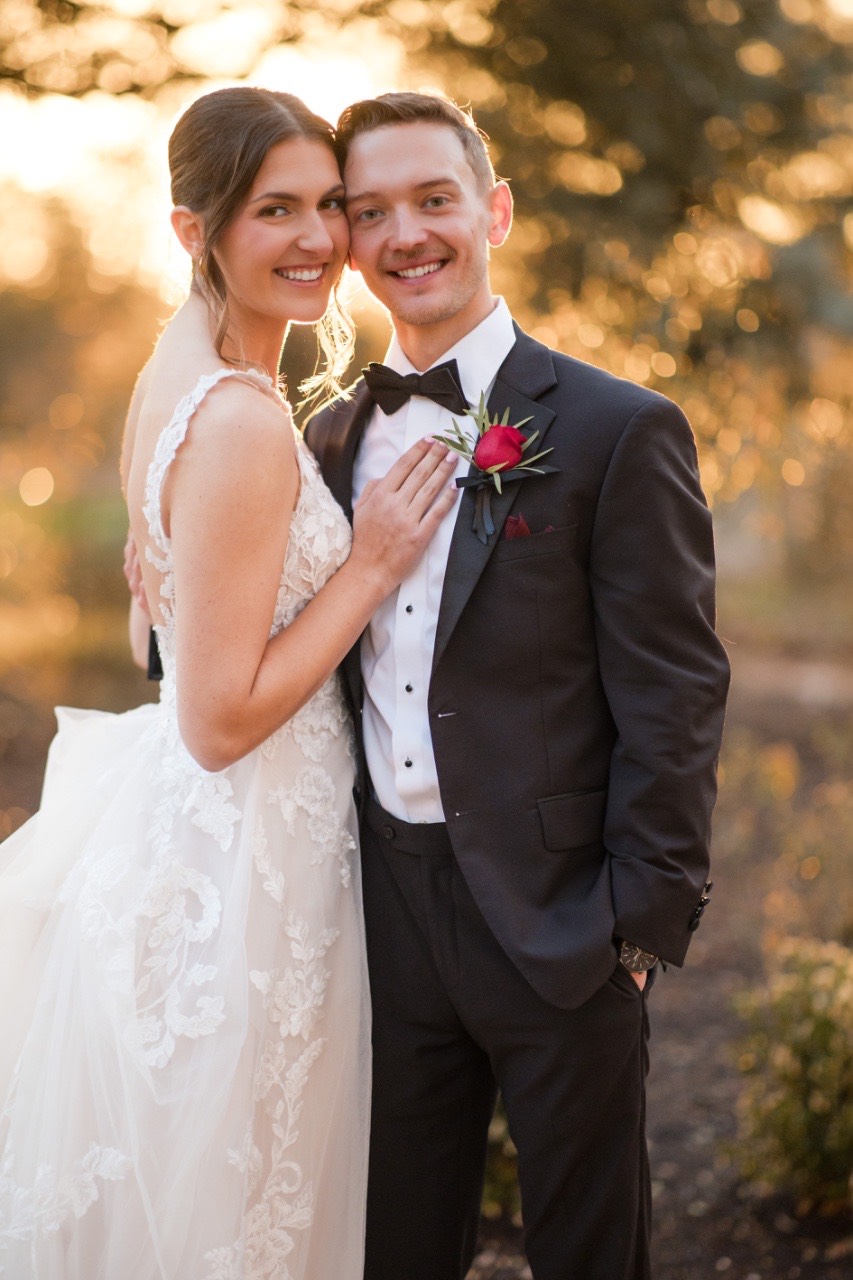 Groom's reaction as bride walks down aisle in rain.