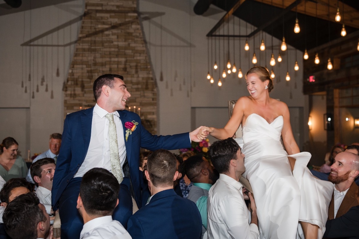 Reception hall grand reveal with barn doors opening at Canyonwood Ridge wedding