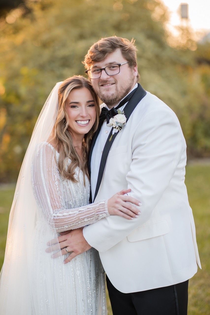 Bride's bouquet by Bloom Bar featured in couple's portrait at Barr Mansion.