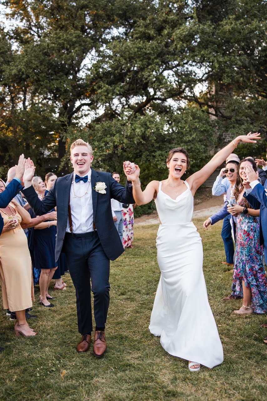 Bride and groom greeting guests during cocktail hour at Marble Falls wedding