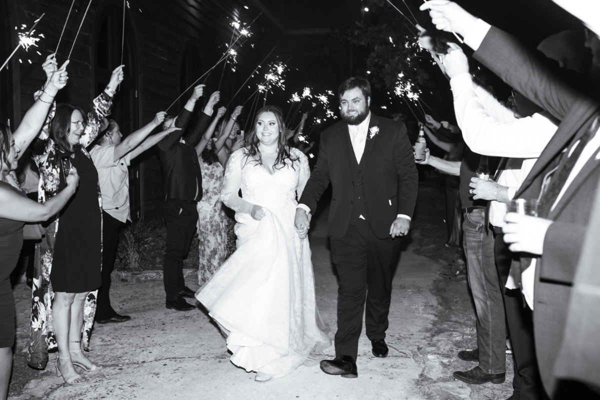 Wedding guests dancing and celebrating at Old Glory Ranch reception in Wimberley