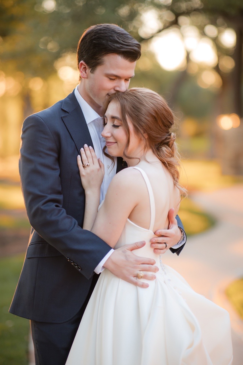 Wedding party celebratory photo at Canyonwood Ridge outdoor wedding in Dripping Springs Texas