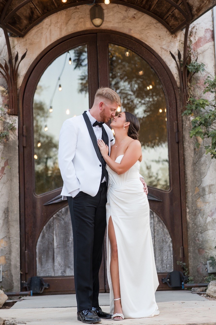 Bride in white gown with groom in suit at Barr Mansion fall wedding