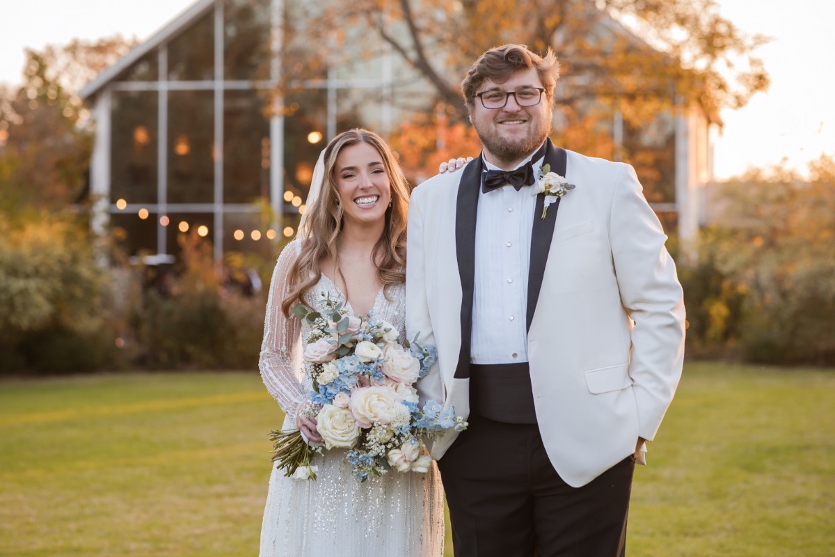 Couple's candid laughter captured during portrait session at Barr Mansion venue.