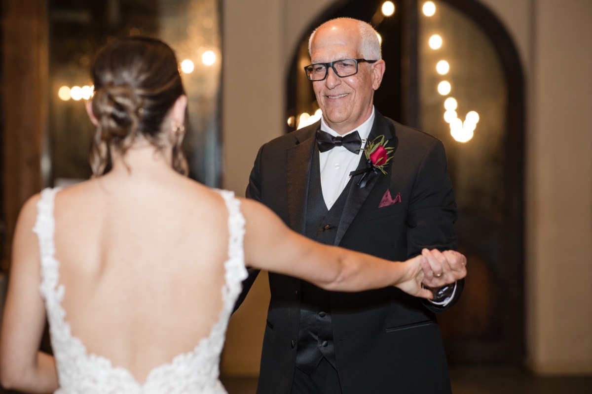 Couple portrait session after ceremony at rainy Barr Mansion venue.