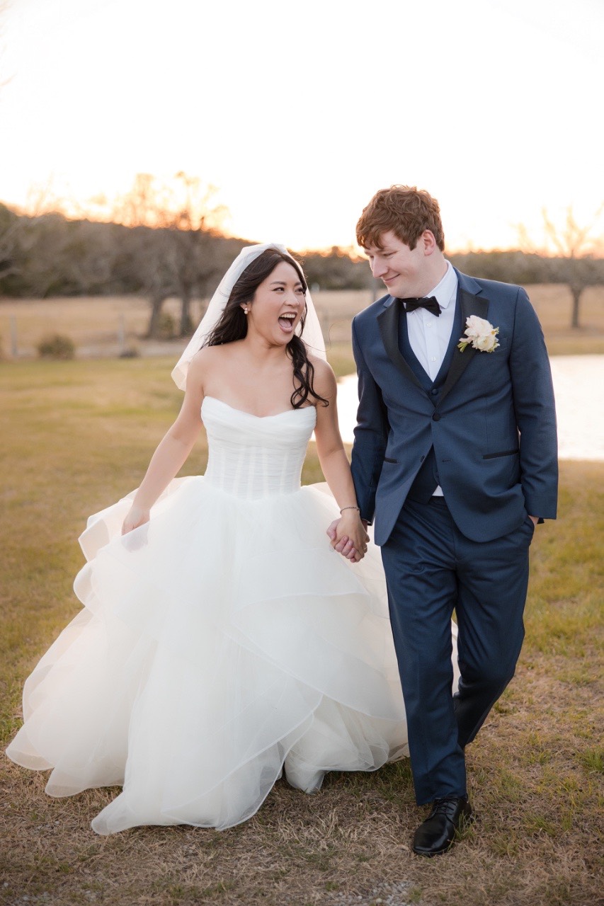 Bride L dancing with groom M during first dance at Pecan Springs Ranch