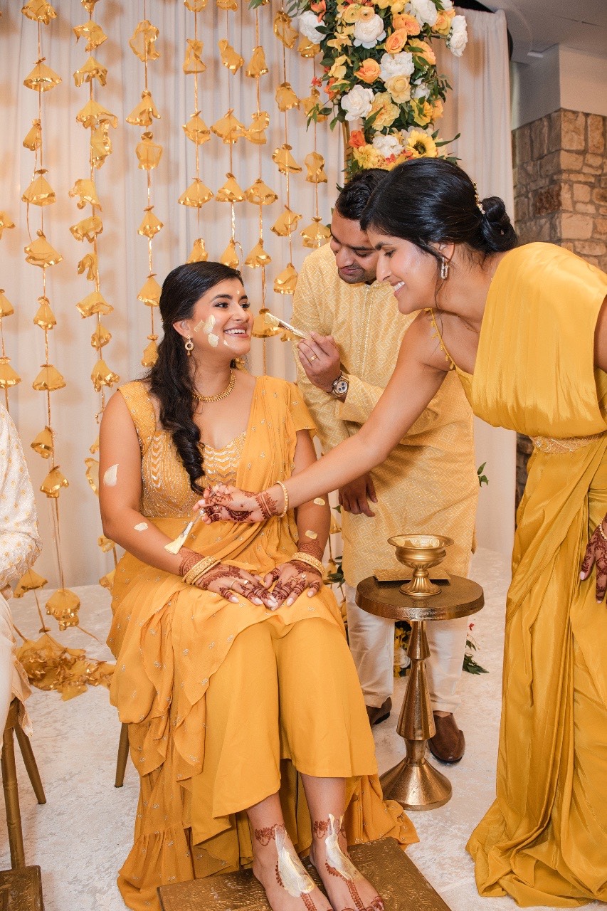 Professional makeup artist applying final touches to bride R before Renaissance Austin wedding
