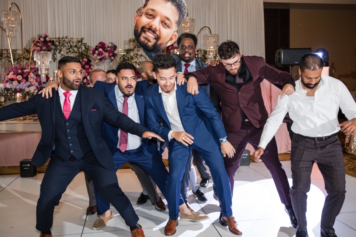 Groom kissing bride's forehead during San Antonio wedding portraits