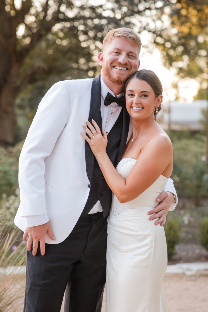 Groom's portrait in suit jacket at Barr Mansion fall wedding in Austin