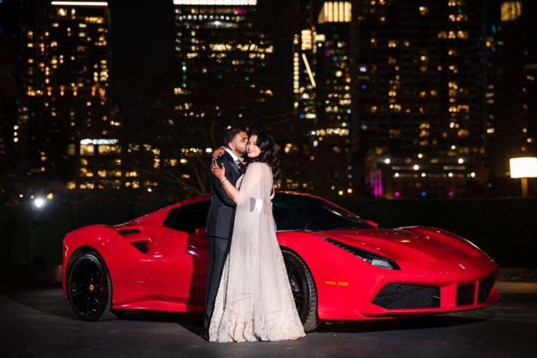 Bride and groom on top of the Hyatt regency Austin with a Lamborghini