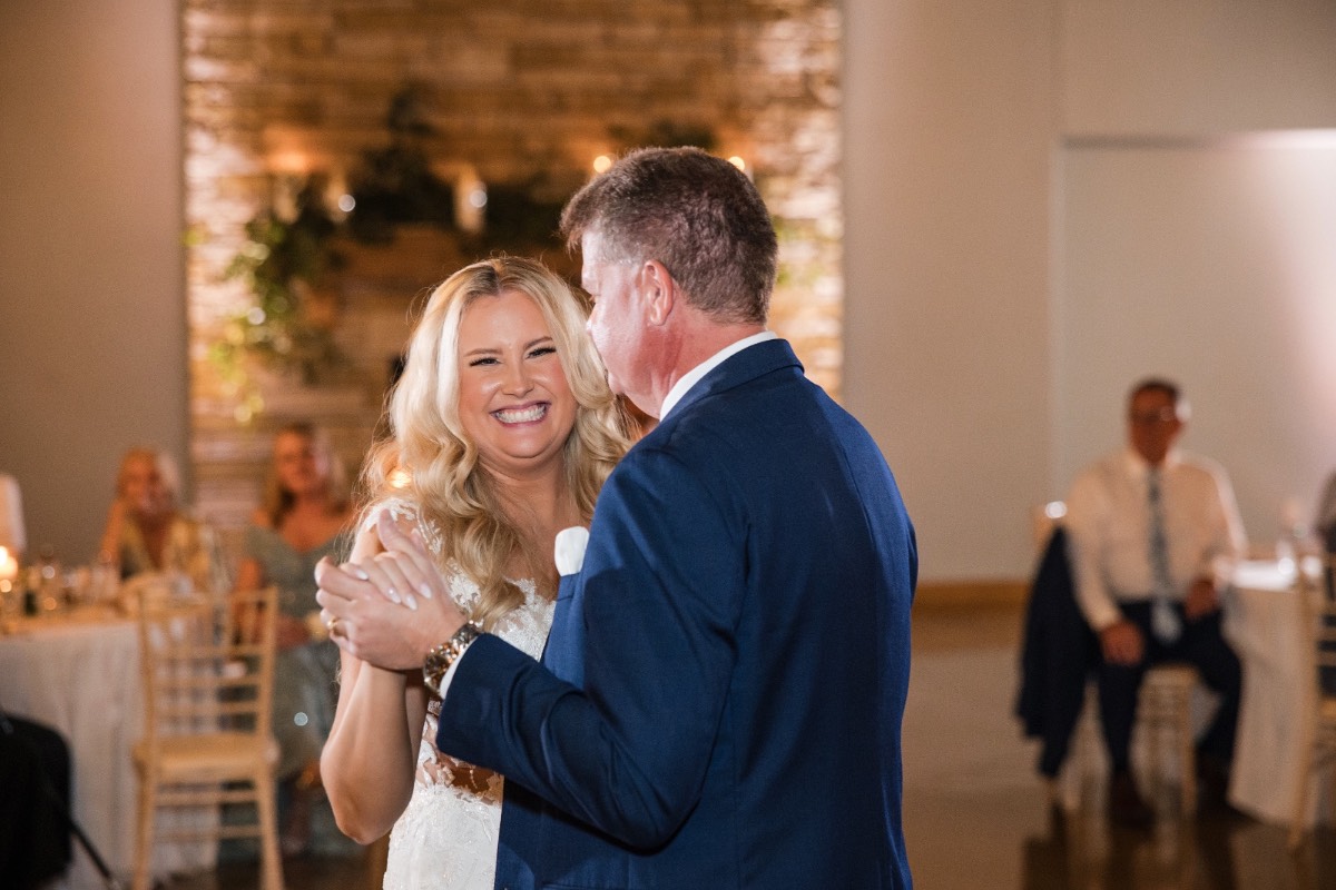 K posing with bridesmaids at Canyonwood Ridge outdoor winter venue