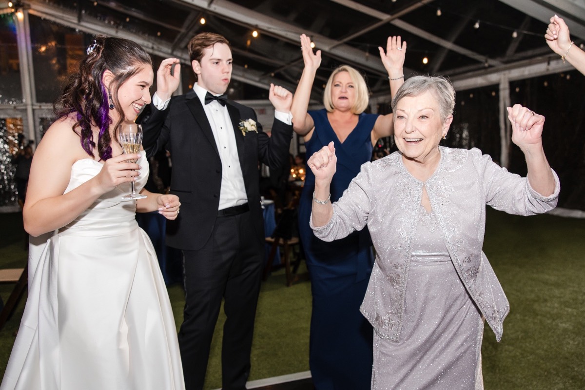 Guests watching newlyweds during first dance at Woodbine Mansion