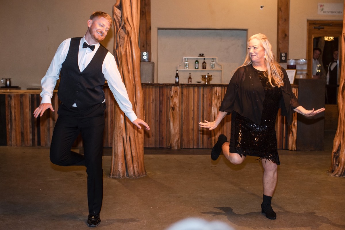 Bride and groom greeting guests during cocktail hour at Barr Mansion Austin