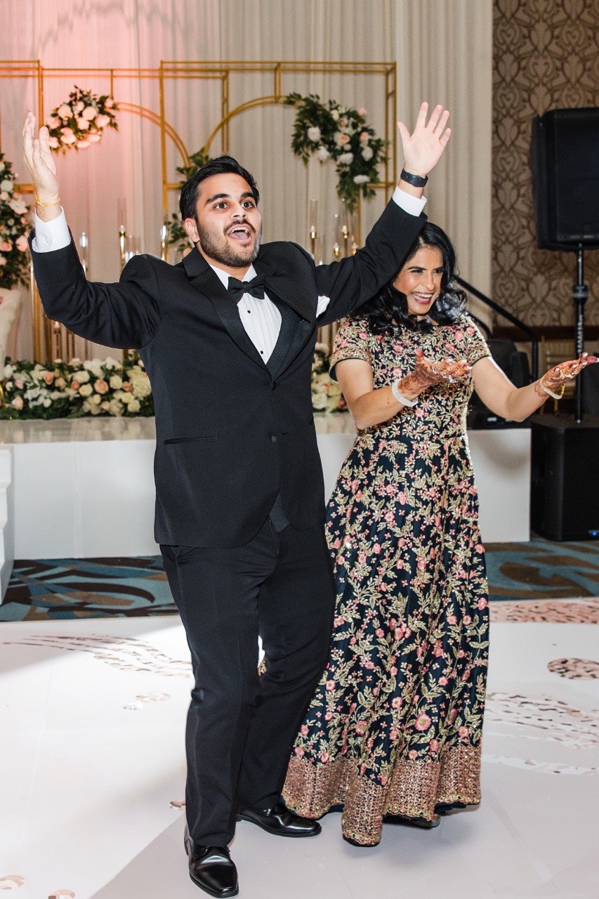 Mother of groom dancing with S at Hyatt Regency Austin venue