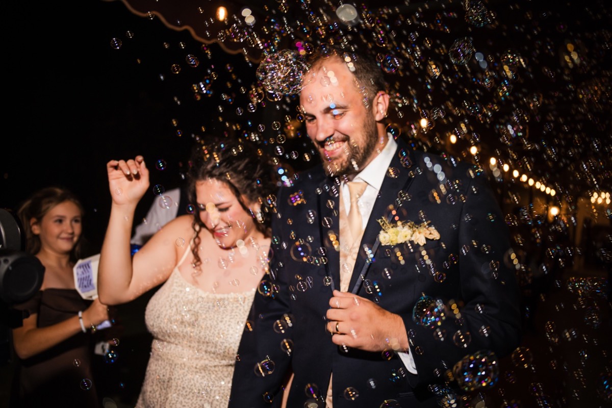 Maid of honor sharing emotional speech about C and C at reception