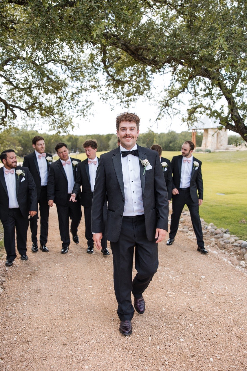 Newlyweds P and B glowing amid sparklers at Lampasas wedding