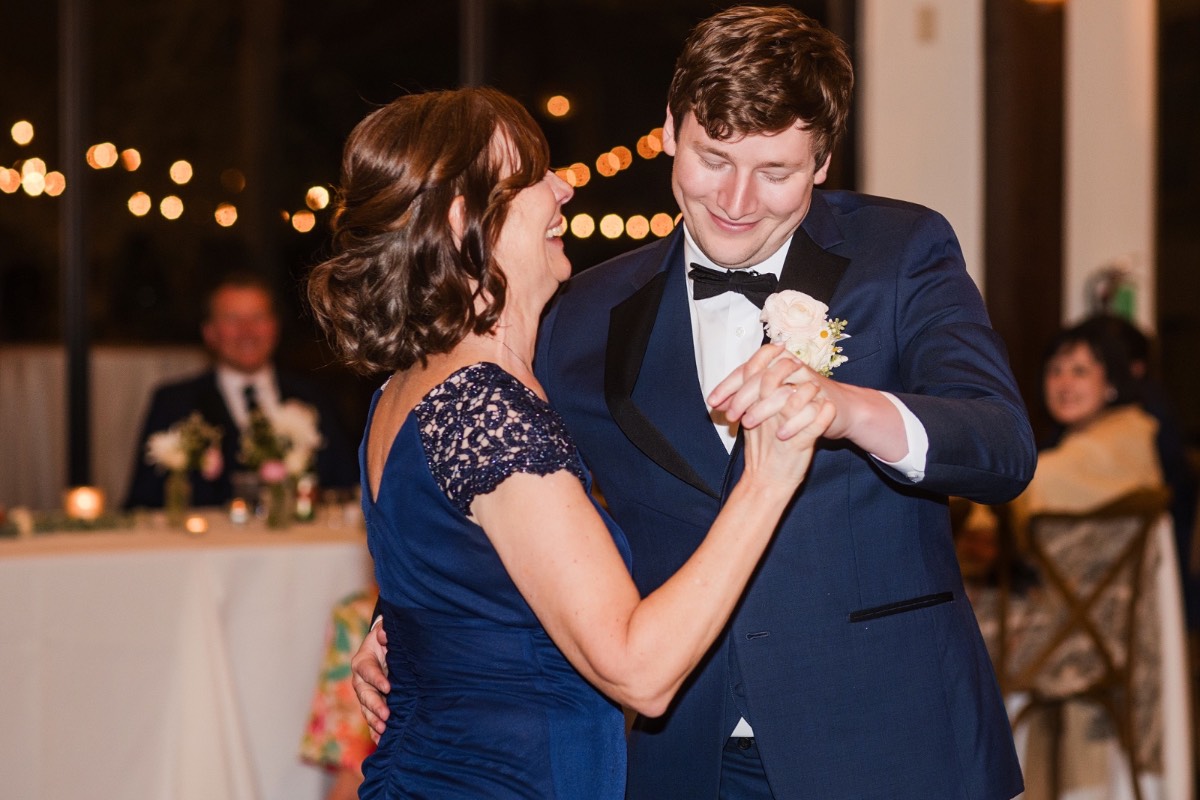 L and M dancing together during reception at Pecan Springs Ranch wedding