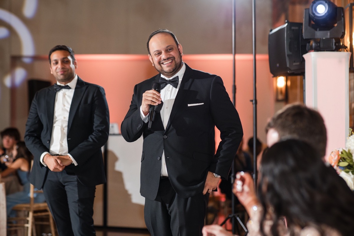 Cake cutting moment for couple at Canyonwood Ridge Indian wedding
