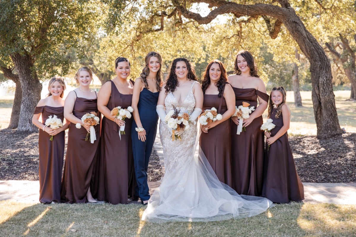 First dance of newlyweds under twinkling lights at Dripping Springs venue