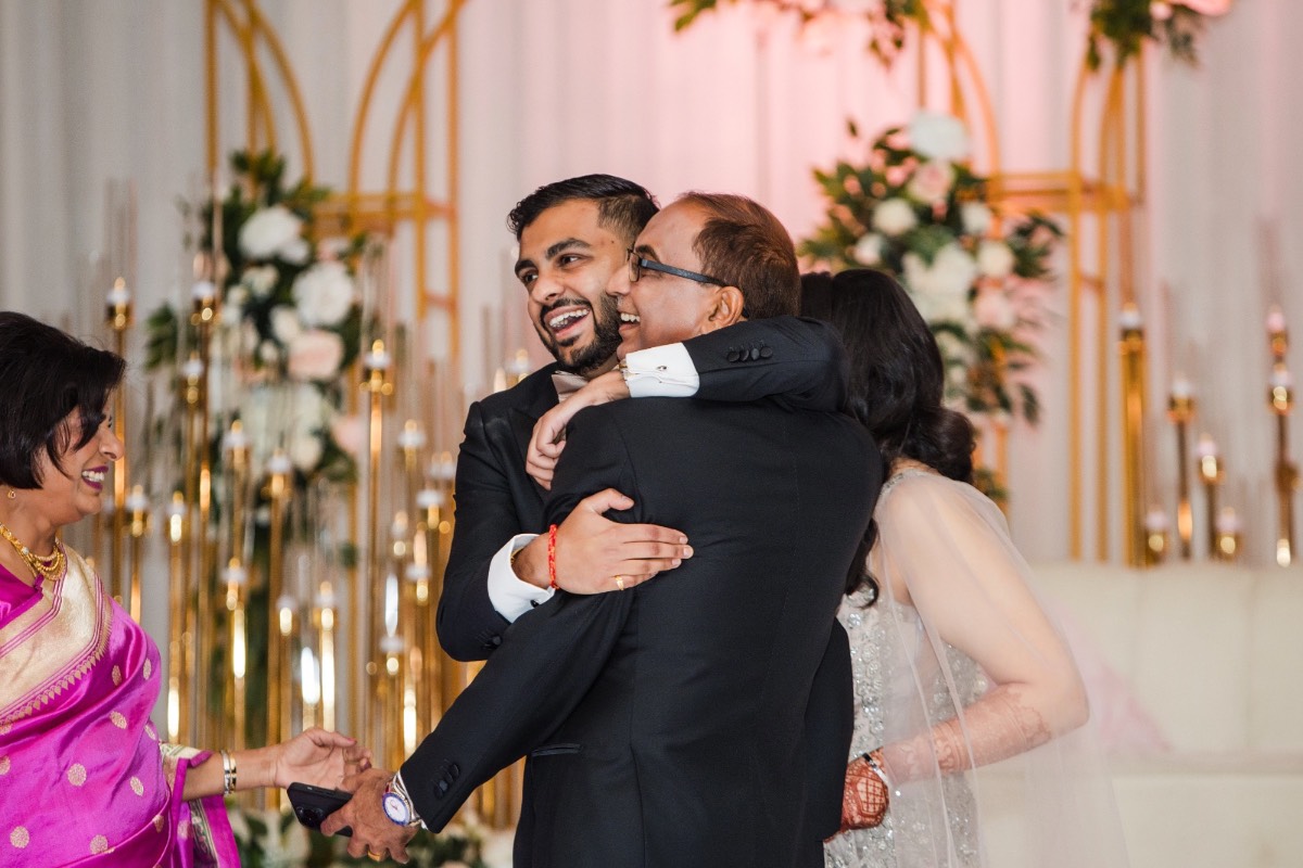 Guests laughing during toasts at Hyatt Regency Austin wedding reception