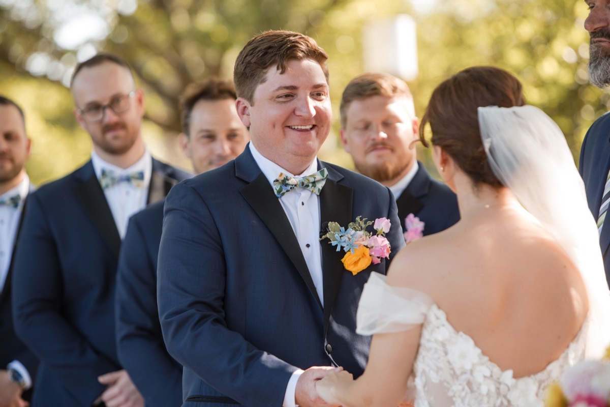Groom S dipping bride L during portrait session at Barr Mansion
