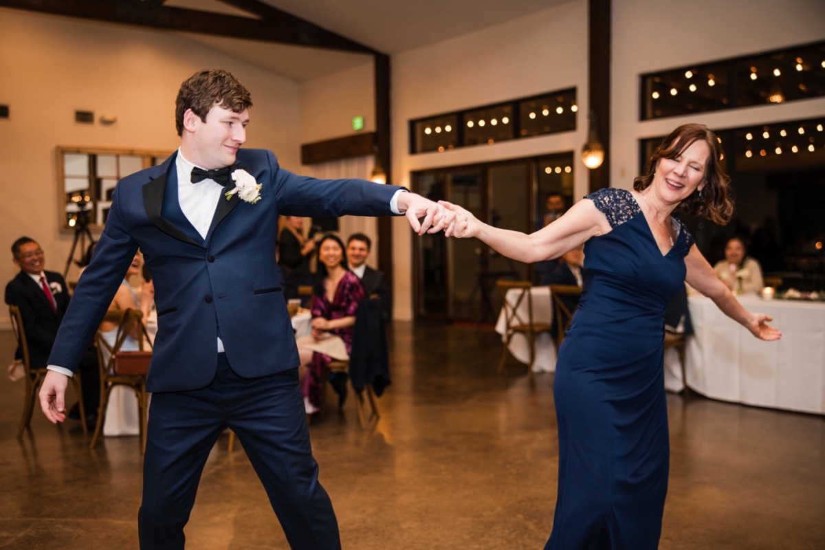 Bride and groom L and M on dance floor at Pecan Springs Ranch