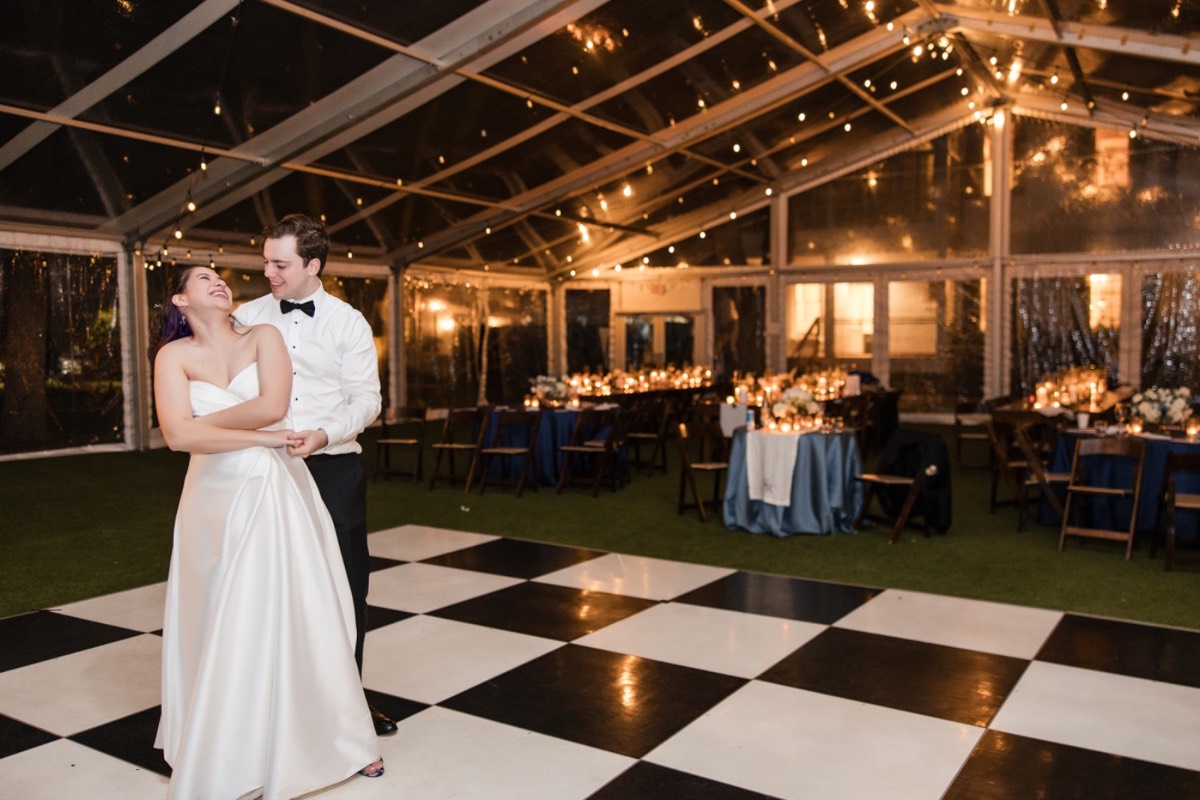 Guests laughing during toasts at Woodbine Mansion Round Rock Texas