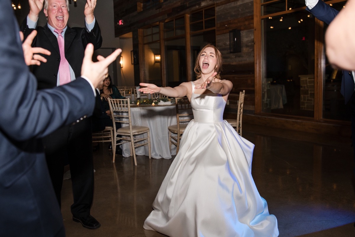 Wedding guests dancing during evening reception at Canyonwood Ridge in Texas