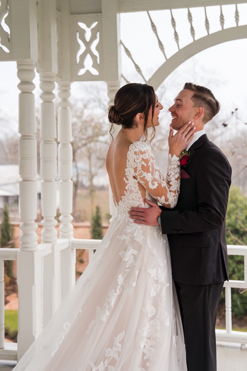 Family portraits during rainy wedding at Barr Mansion venue.