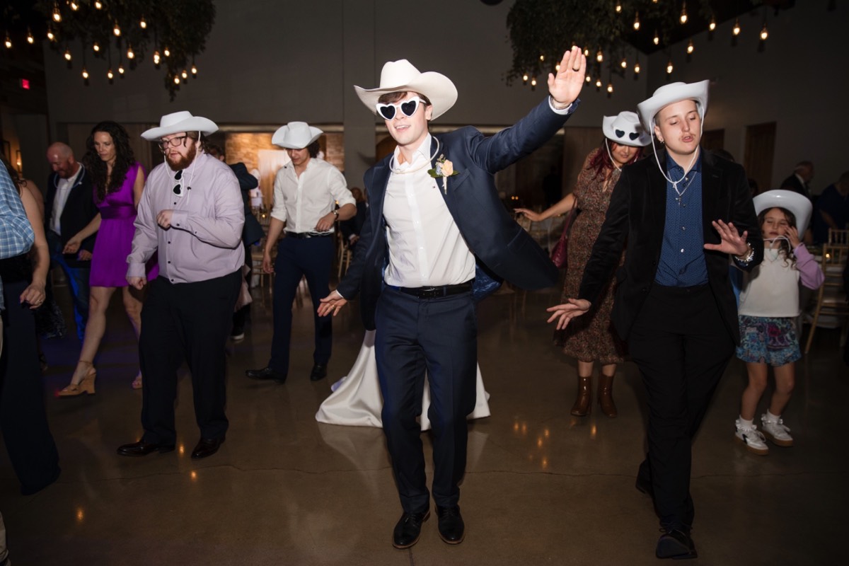 Bride and groom dancing with guests at Canyonwood Ridge outdoor wedding