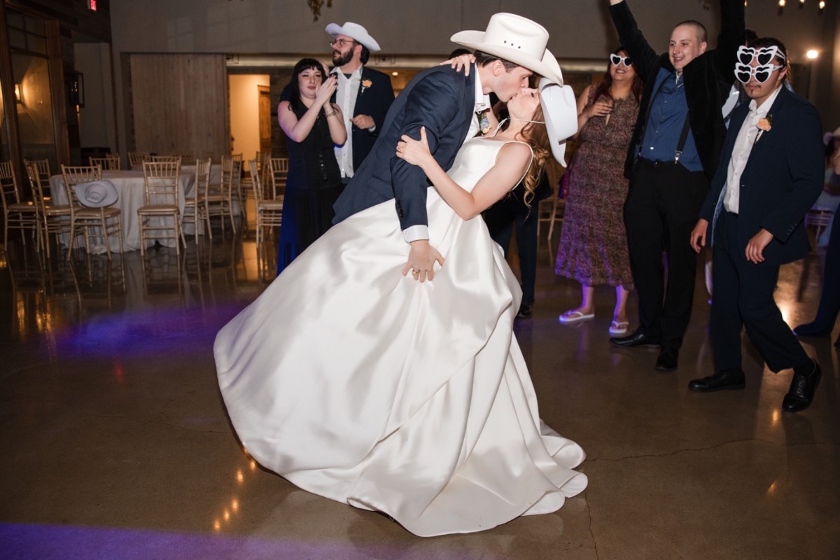 Bride O and groom C cut their wedding cake at Canyonwood Ridge