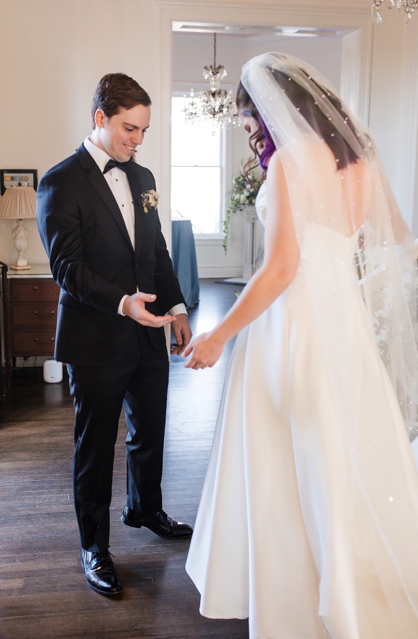 Bride getting hair styled by makeup artist at Round Rock wedding